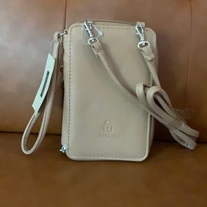 Tan wristlet with cross body attachment